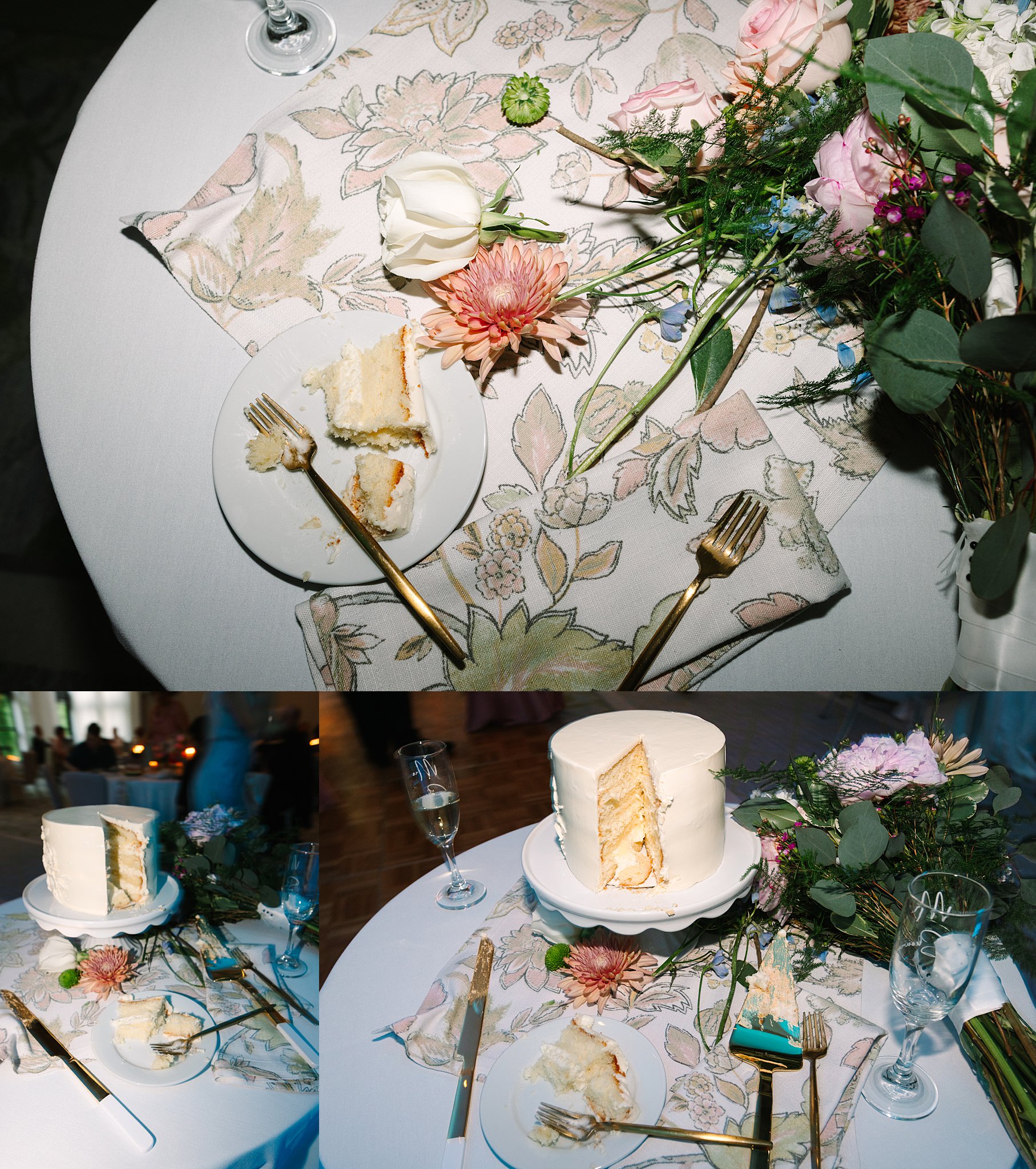 A small round table with a white and floral-patterned tablecloth holds a partly sliced white cake, flowers, a champagne glass, a fork, and plates with partially eaten cake slices.