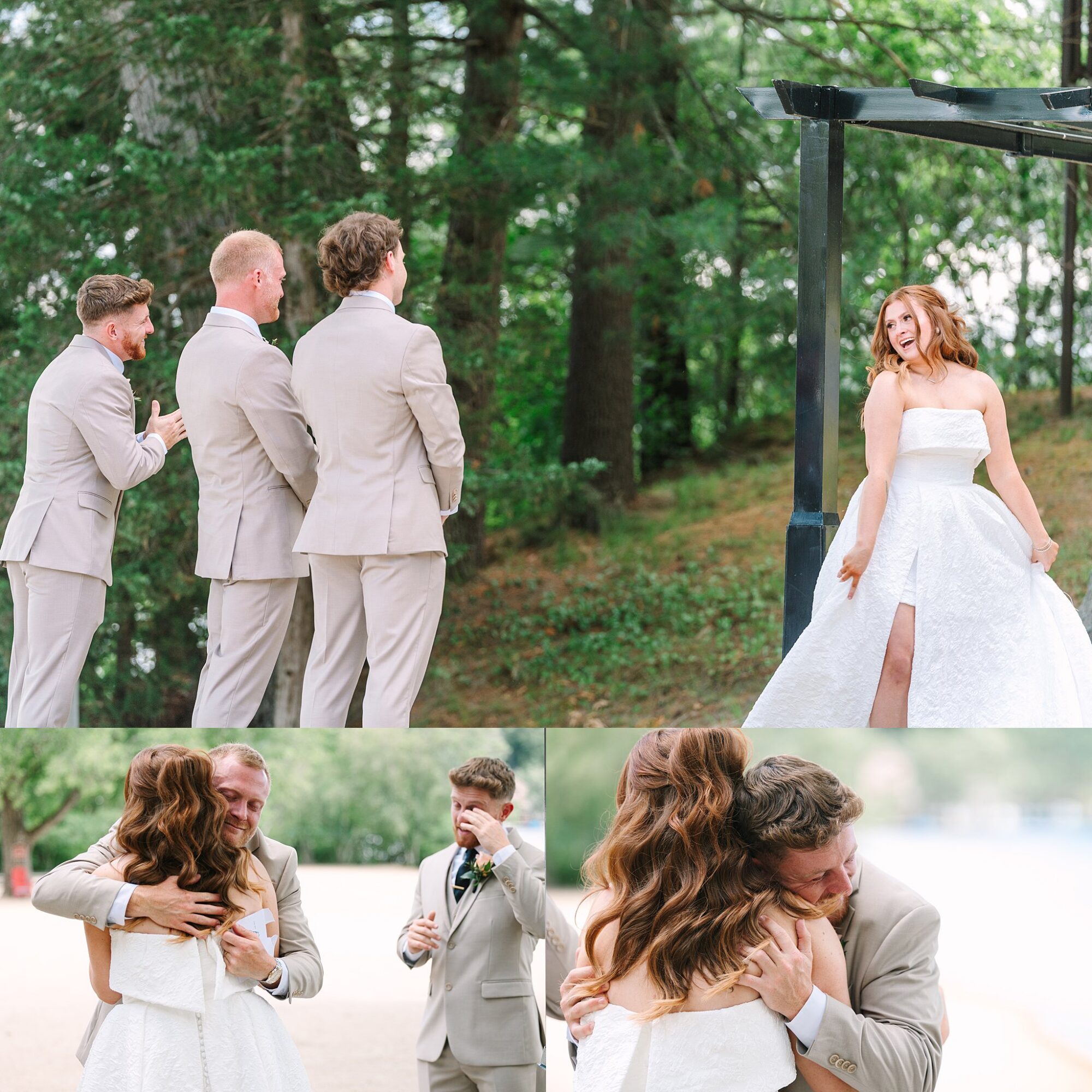 A bride in a white dress surprises three men in beige suits outdoors; they react with joy and hugs in a wooded, lakeside setting.