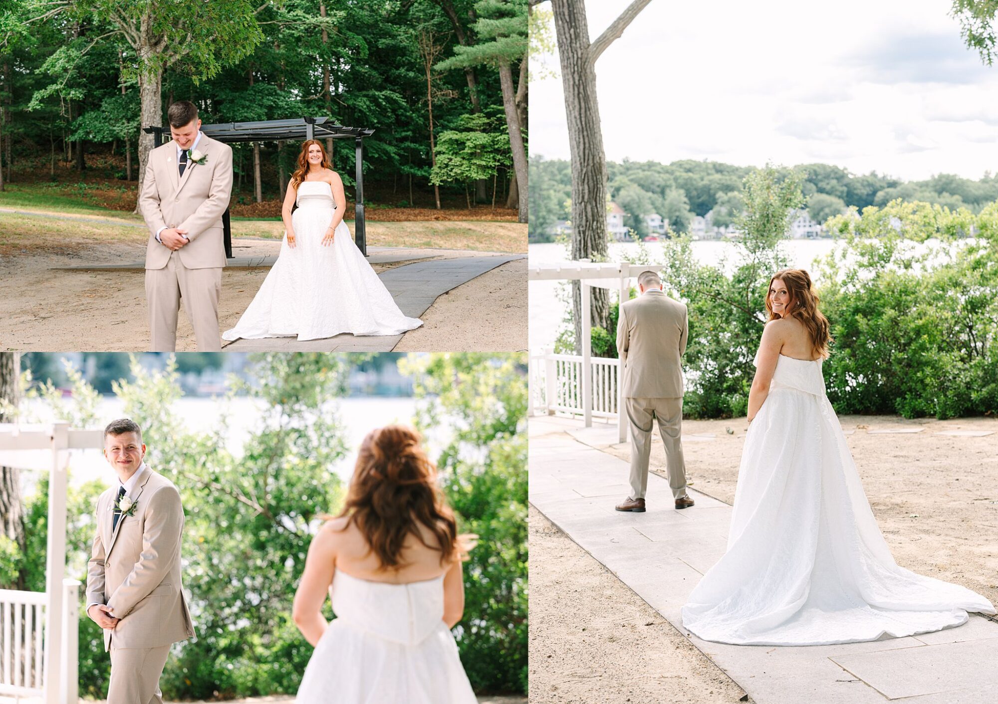A bride in a white dress approaches her groom in a beige suit during their outdoor first look photos; both look happy and excited, surrounded by greenery and a lakeside background.