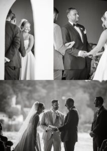 A bride and groom exchange vows and smiles during their wedding ceremony, holding hands and standing with officiants, captured in black and white.
