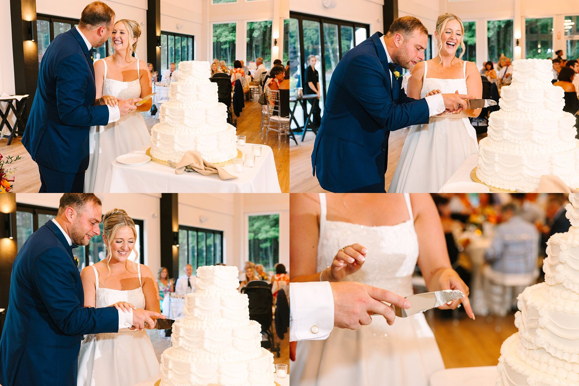 A bride and groom in formal attire cut a tiered white wedding cake together, smiling and laughing, surrounded by wedding guests in a bright, elegant venue. Close-ups show their hands and the cake.