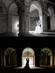 A bride and groom embrace under stone arches. The top image is in black and white, showing details; the bottom image is a dark silhouette of the couple framed by illuminated arches.