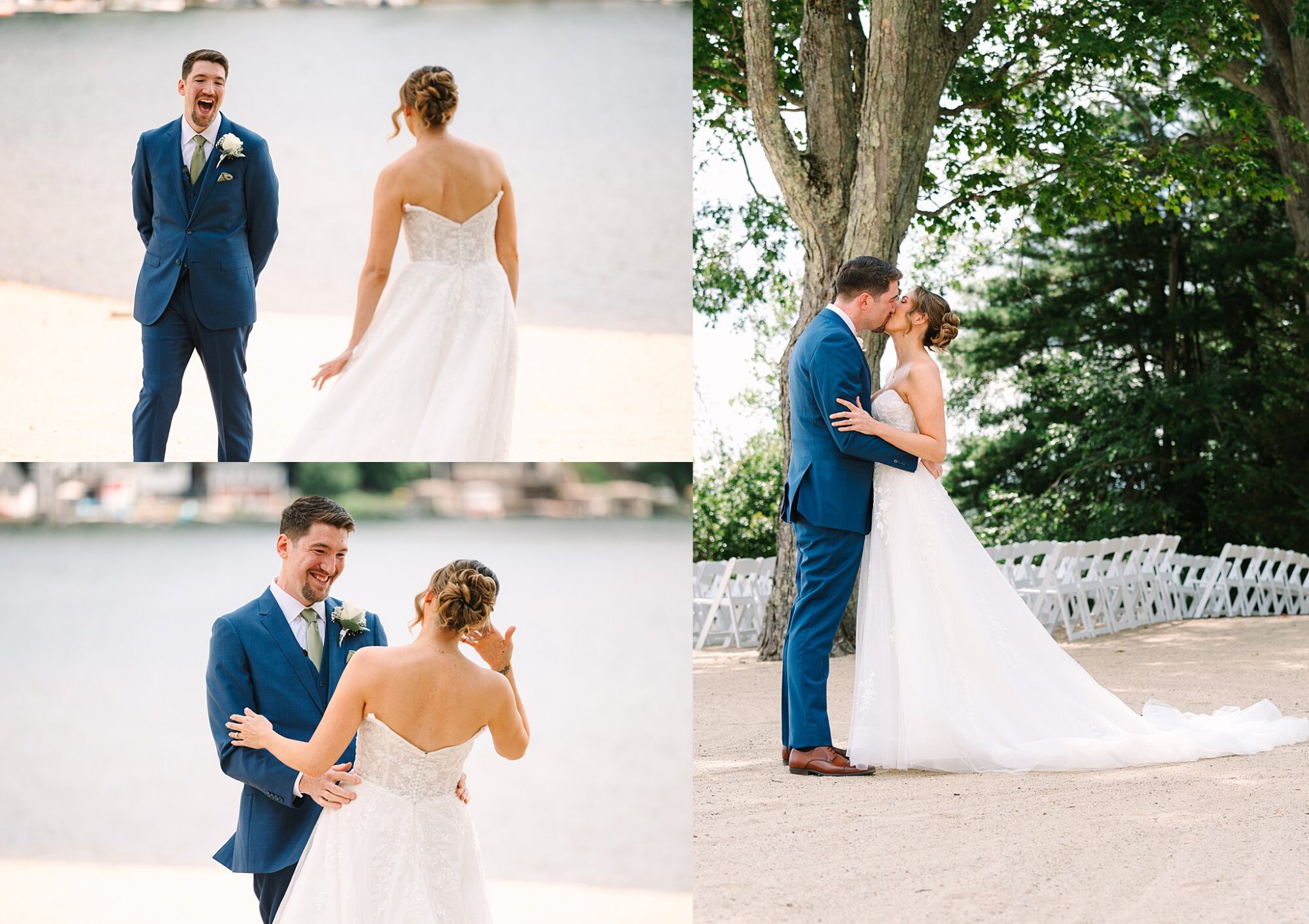 A bride and groom have their first look by a lake. The groom reacts with joy, and they share a kiss under trees with white chairs behind them.