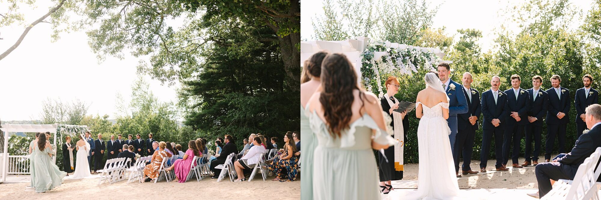 A bride and groom stand under a floral arch outdoors, exchanging vows before seated guests. Bridesmaids and groomsmen in pastel and navy attire stand nearby. Sunlight filters through green trees.