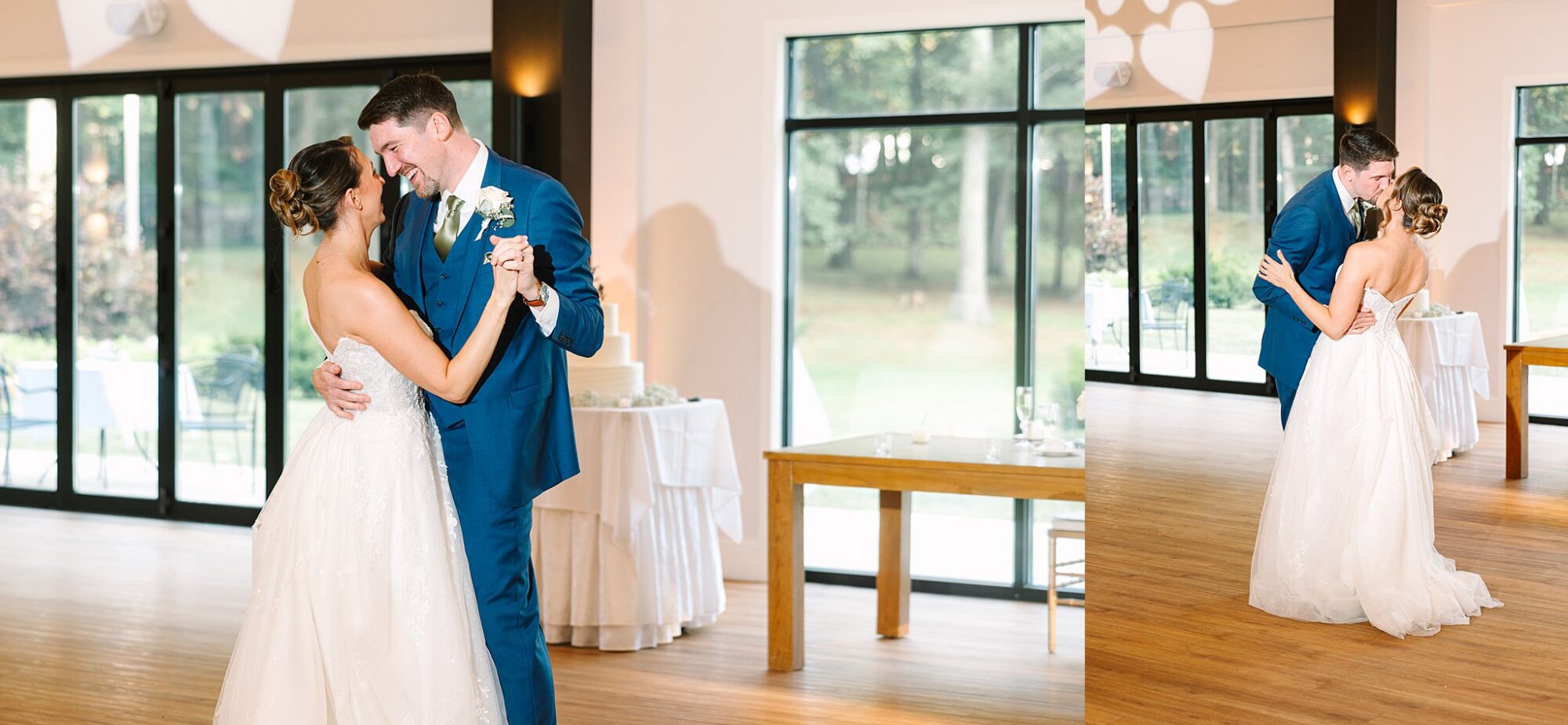 A bride and groom share their first dance in a bright room with large windows, both smiling joyfully. The bride wears a white gown and the groom is in a blue suit.