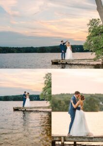 A bride and groom stand and embrace on a wooden dock by a lake at sunset, surrounded by calm water and trees, under a colorful sky.